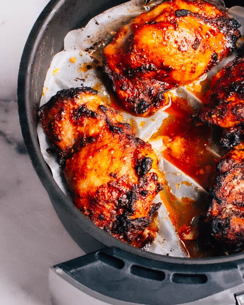Checking on Boneless Chicken Thighs in Air Frying Basket