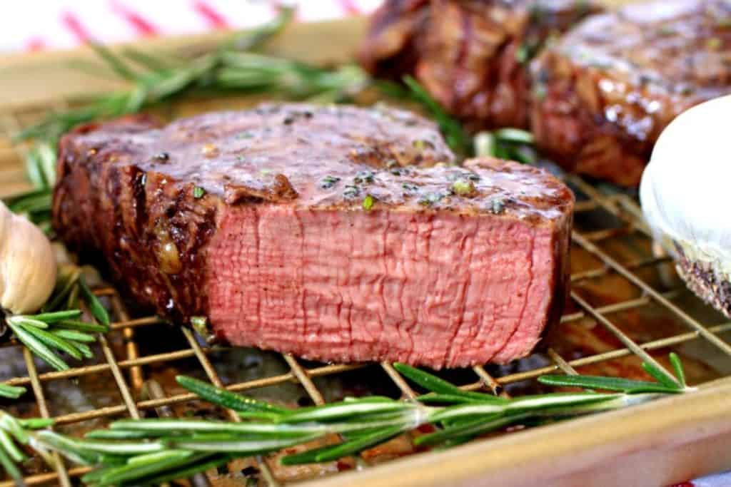 filet mignon with rosemary sliced against the grain